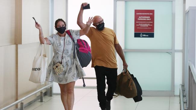 The first couple to arrive, Pauline and Ant Davies, wave to the crowd. Picture Glenn Hampson