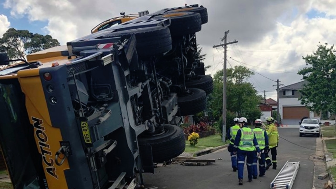 Toppled crane traps driver