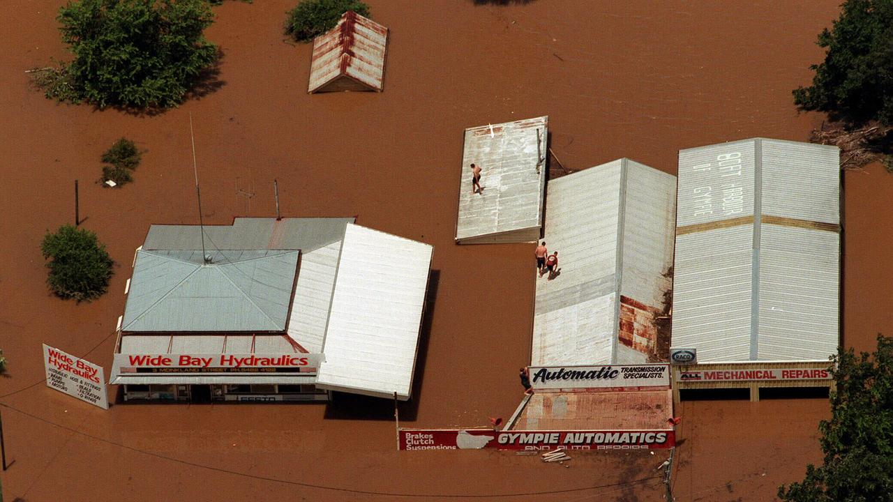 People on the rooftops of flooded businesses in Gympie, February 10, 1999. Photo: Nathan Richter