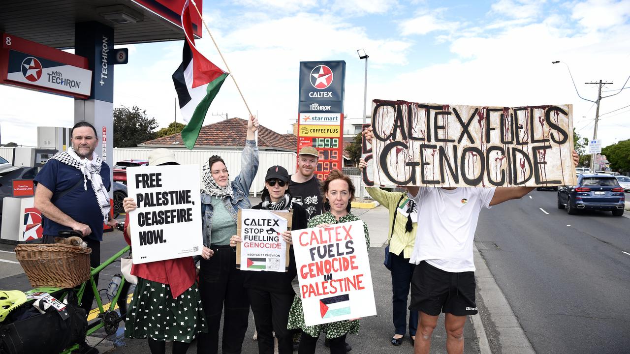 Protesters gathered outside a Caltex petrol station on Murray Rd in Preston. Picture: NewsWire / Andrew Henshaw