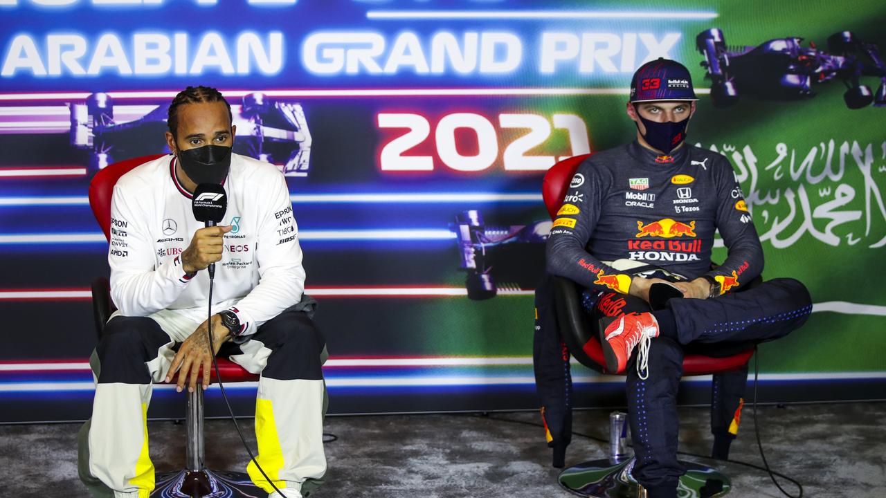 JEDDAH, SAUDI ARABIA - DECEMBER 04: Pole position qualifier Lewis Hamilton of Great Britain and Mercedes GP and third place qualifier Max Verstappen of Netherlands and Red Bull Racing talk in the press conference after qualifying ahead of the F1 Grand Prix of Saudi Arabia at Jeddah Corniche Circuit on December 04, 2021 in Jeddah, Saudi Arabia. (Photo by Florent Gooden - Pool/Getty Images)