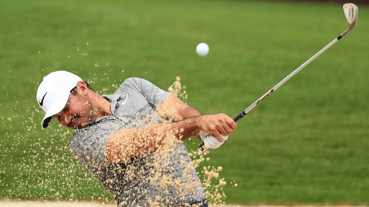 Jason Day of Australia plays from a bunker on the 5th hole. Picture: Brett Costello