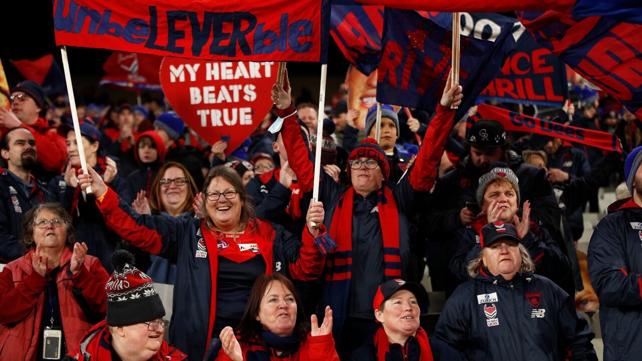 Melbourne Demons fans celebrate in lockdown