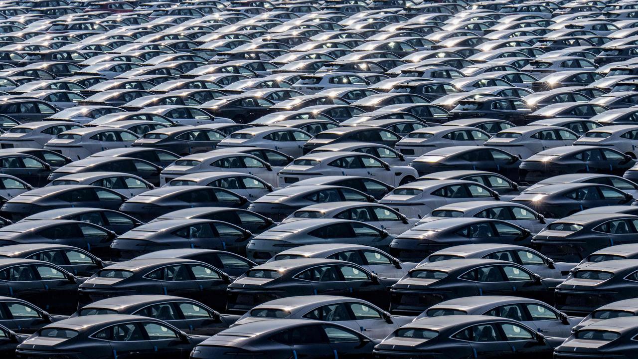 New electric cars for sale are seen parked at a distribution centre of the Changan automobile company in southwestern China's Chongqing municipality Picture: AFP / China OUT