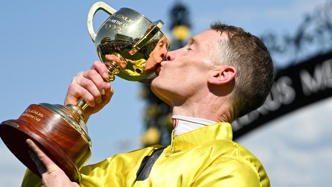 Mark Zahra kisses the Melbourne Cup. Picture: Vince Caligiuri/Getty Images