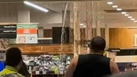 DOWNFALL: Warwick Shoppers gather around a big leak in Rose City Shoppingworld’s roof following an afternoon shower (Photo: Facebook)