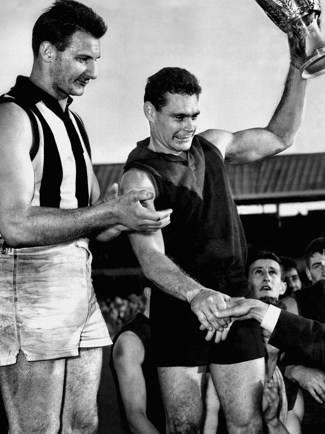 The famous photo of Ron Barassi lifting the premiership cup in 1964.