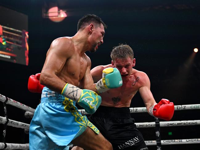 Janibek Alimkhanuly deals out punishment to Andrei Mikhailovich in the IBF middleweight title bout. Picture: No Limit Boxing