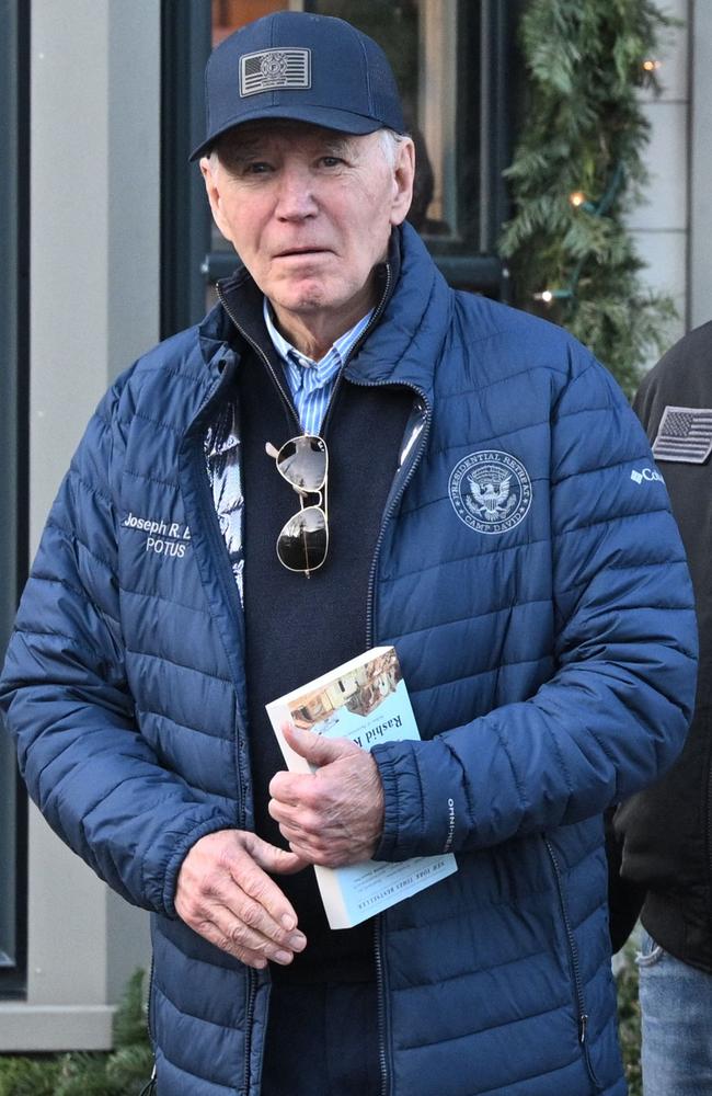 US President Joe Biden holds the book ‘The Hundred Years' War on Palestine’ by Rashid Khalidi as he walks out of Nantucket Bookworks in Nantucket, Massachusetts. Picture: Mandel Ngna/AFP