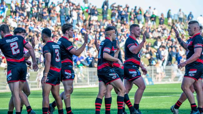 Collegians celebrate a try. Picture: Thomas Lisson