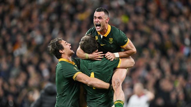 Jesse Kriel of South Africa celebrates with teammates Franco Mostert and Eben Etzebeth following the team's victory. Photo by Hannah Peters/Getty Images.