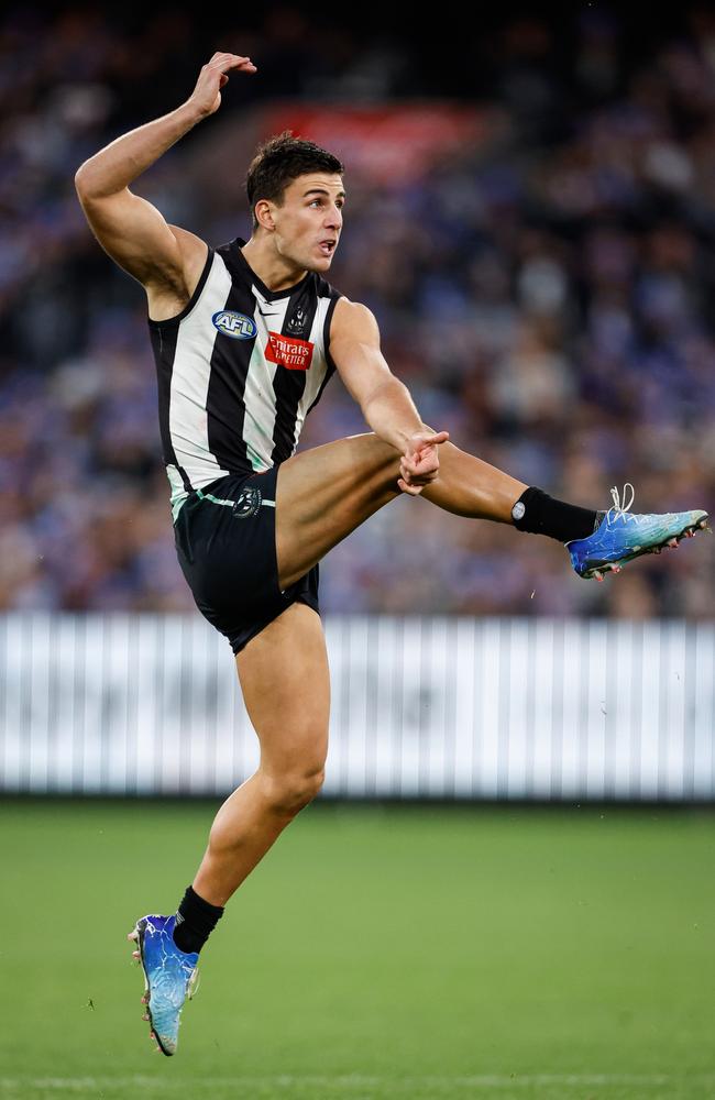 Nick Daicos of the Magpies kicks a goal at the MCG. Picture: Dylan Burns/AFL Photos via Getty Images.