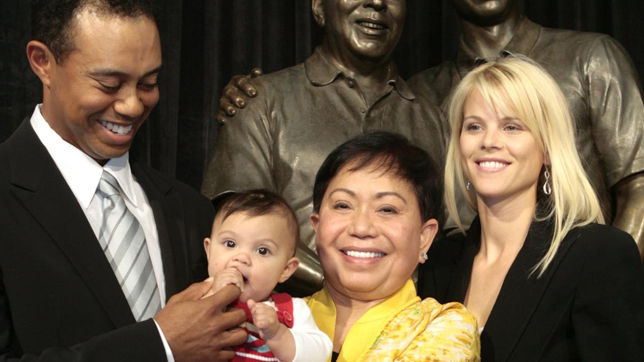 Tiger Woods, left, smiles as he stands with his daughter Sam, mother Kultida and wife Elin Nordegren.