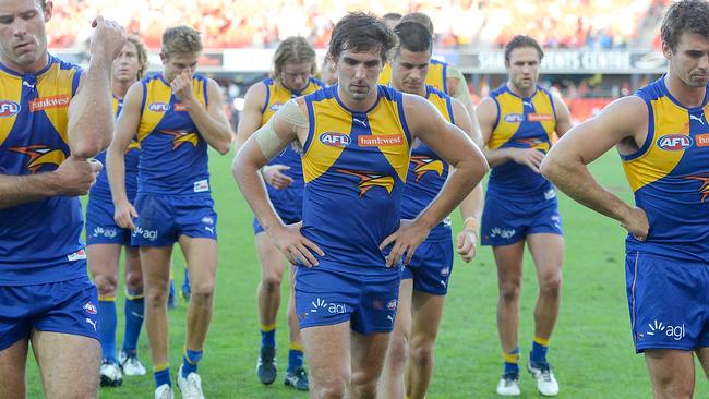 GOLD COAST, AUSTRALIA — JUNE 03: West Coast players look dejected after losing the round 11 AFL match between the Gold Coast Suns and the West Coast Eagles at Metricon Stadium on June 3, 2017 in Gold Coast, Australia. (Photo by Bradley Kanaris/Getty Images)