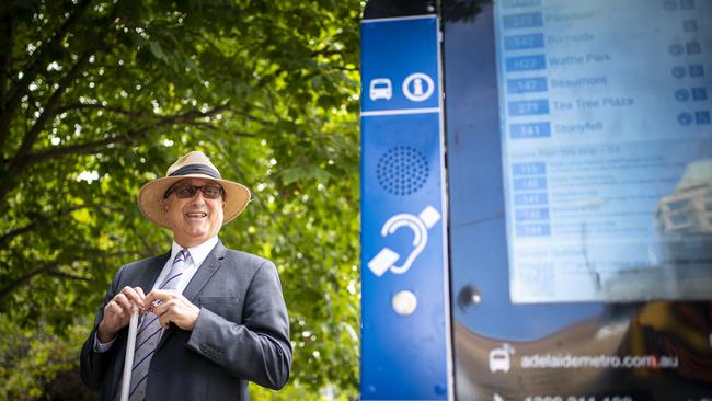 Tony Starkey at a city bus stop with an audiovisual information system. Picture: Mike Burton