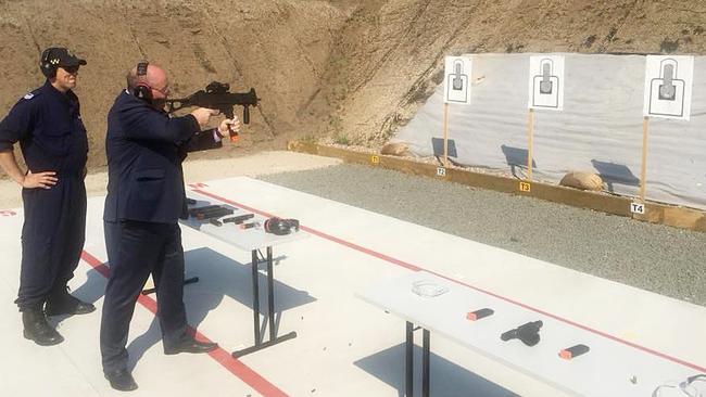 NSW Police Minister David Elliott fires a Heckler &amp; Koch submachine gun at John Morony Correctional Centre. Picture: Facebook