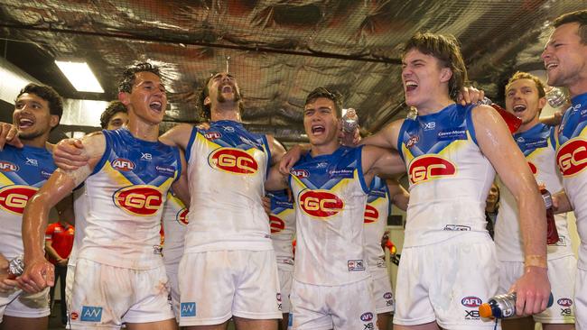 Gold Coast Suns players belt out the team song after their historic win against the Swans on Saturday. Picture: AAP Image/Craig Golding