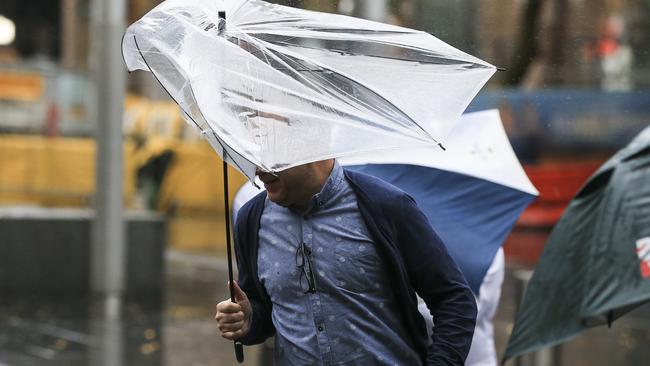 Heavy rain and wind hits Circular Quay as Sydney endures bad weather. Picture: Dylan Robinson