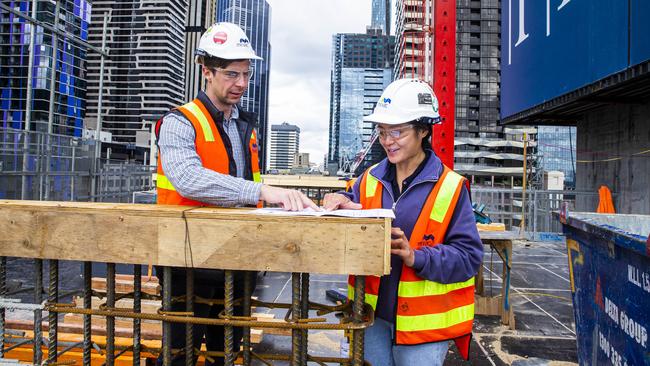 Site engineers Chris Nixon and Jo Cheng at a Mirvac development in Melbourne on Monday. Picture: Aaron Francis