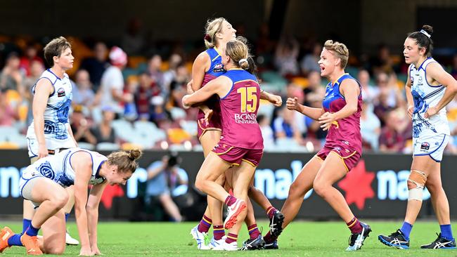 Courtney Hodder is congratulated by teammates after sealing victory against the Kangaroos. Picture: Bradley Kanaris/Getty Images