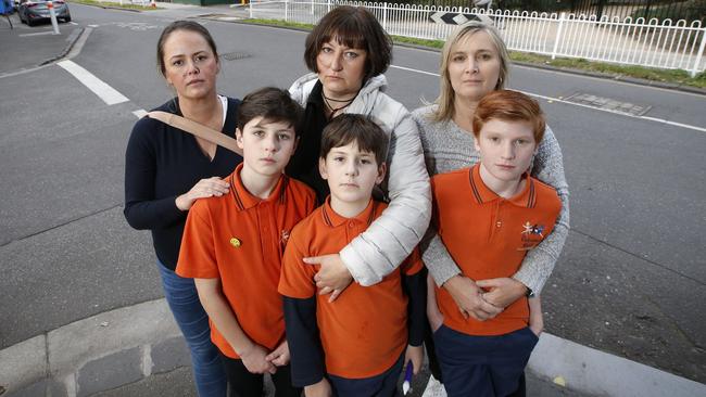 Beth Halls and Elena Markushina, with sons Roman, 10, and Maxim, 8, and Jo Murphy, with son Cade, 11, near the Richmond injection rooms. Picture: David Caird