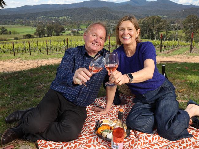 For Taste. Alfredo (Fred) and Katrina Pizzini of Pizzini Wines in Whitfield enjoy their latest vintage overlooking the vineyard.                     Picture: David Caird