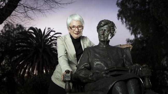 Cathy Branson with a statue of Dame Roma Mitchell. Picture: Shane Reid