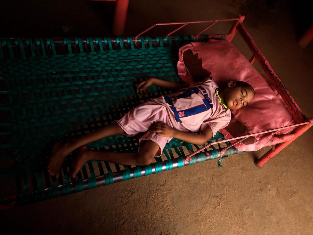 The four-year-old son of Awadya Ahmed, born blind and crippled, a handicap that she blames on a large mound of gold mining waste left near her house, lies in a bed in her home in the village of Banat in River Nile state, north of the Sudanese capital Khartoum.