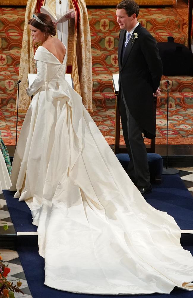 Princess Eugenie of York passes her bouquet to bridesmaid Savannah Phillips during her wedding to Jack Brooksbank at St. George’s Chapel on October 12, 2018 in Windsor, England. (Photo by - WPA Pool/Getty Images)