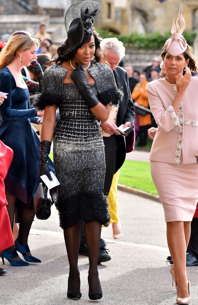 Black leather gloves? How wild you think that reception’s gonna get, Naomi? Getty