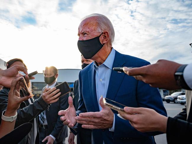 TOPSHOT - Democratic Presidential Candidate Joe Biden speaks with the press before departing Charlotte, North Carolina, on September 23, 2020. (Photo by JIM WATSON / AFP)