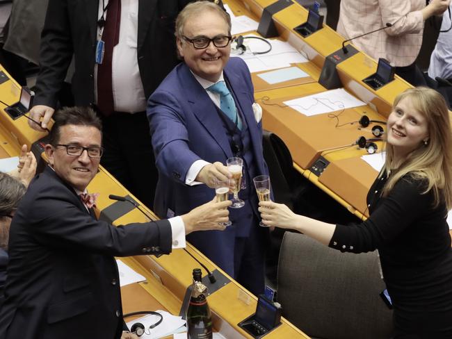 British MEP John Longworth, centre, celebrates with champagne with other British MEP's after a vote on the UK's withdrawal from the EU, the final legislative step in the Brexit proceedings, during the plenary session at the European Parliament. Picture: AP