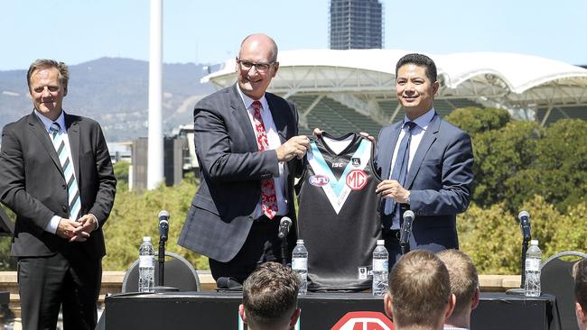 Port Adelaide CEO Keith Thomas. left, and president David Koch with Peter Ciao – CEO of MG Motor Australia, announce a sponsorship deal. Picture: SARAH REED