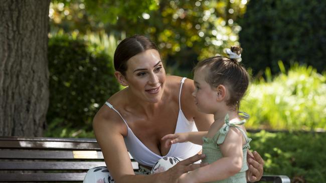 Alex Bunton and daughter Opal at home in Canberra. Picture: Martin Ollman