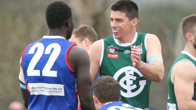 Matthew Kreuzer greets Majak Daw. Picture: Hamish Blair