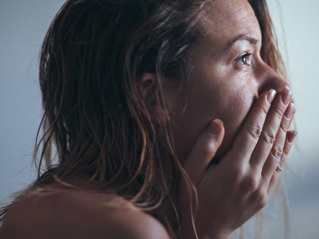 A woman sitting alone and depressed