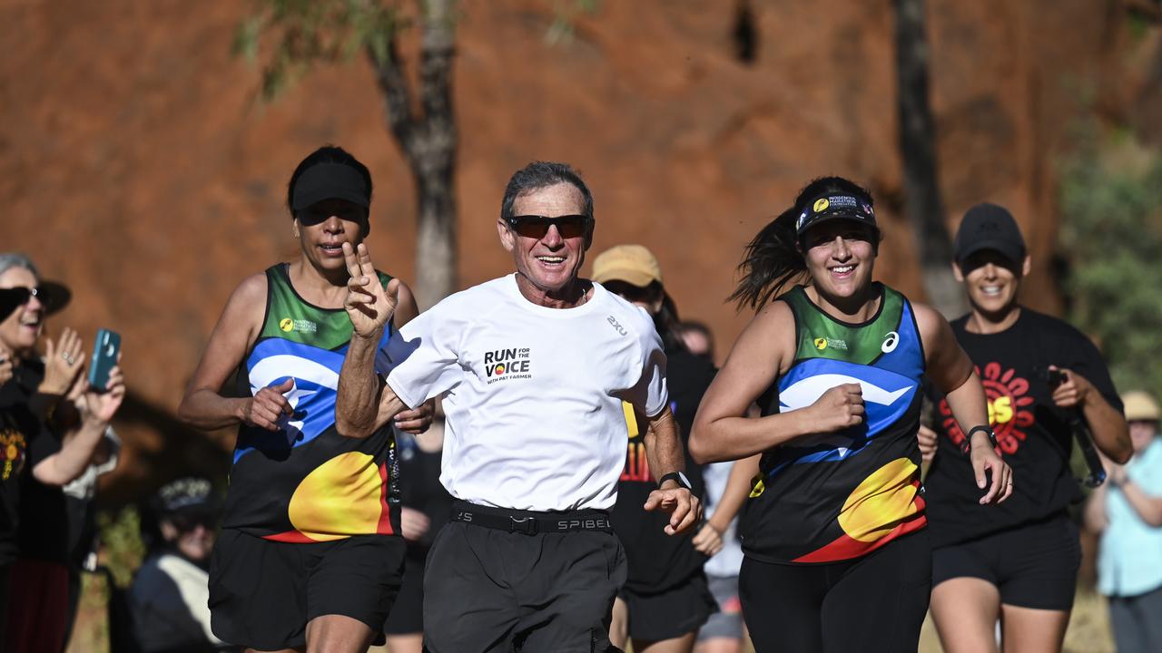 Pat Farmer finished his run around the country to raise awareness about the Yes campaign in Uluru. Picture: NCA NewsWire / Martin Ollman