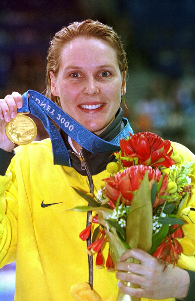 Australian swimmer Susie O'Neill displays her Olympic gold after taking the 200m freestyle at the Sydney Olympic Games in 2000. Picture: AAP Image/Julian Smith