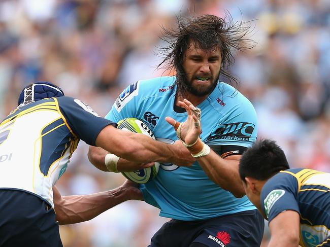 SYDNEY, AUSTRALIA - MARCH 22: Jacques Potgieter of the Waratahs is tackled during the round six Super Rugby match between the Waratahs and the Brumbies at Allianz Stadium on March 22, 2015 in Sydney, Australia. (Photo by Cameron Spencer/Getty Images)