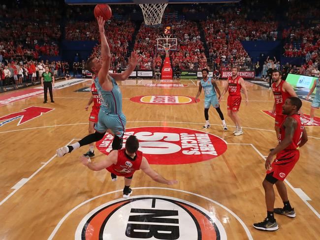 PERTH, AUSTRALIA - APRIL 18: Colton Iverson of the Breakers drives to the basket against Mitchell Norton of the Wildcats during the round 14 NBL match between the Perth Wildcats and the New Zealand Breakers at RAC Arena, on April 18, 2021, in Perth, Australia. (Photo by Paul Kane/Getty Images)