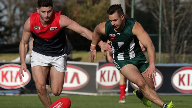 Tullamarine’s Tim Barresi and Airport West’s Brendan Godden. Picture: Mark Dadswell