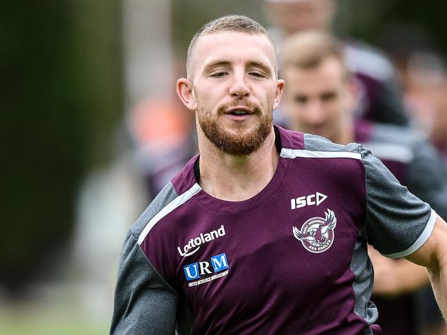 Manly-Warringah Sea Eagles player Jackson Hastings (centre) is seen warming up during a team training session in Sydney, Tuesday, April 3, 2018. (AAP Image/Brendan Esposito) NO ARCHIVING