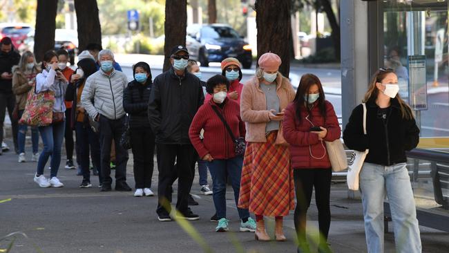 People queue to receive the COVID-19 vaccine at the New South Health Vaccination Centre at Sydney Olympic Park. Picture: Getty Images.