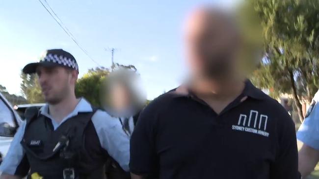 Alan Rifai is arrested by Australian Federal Police in May 2019.