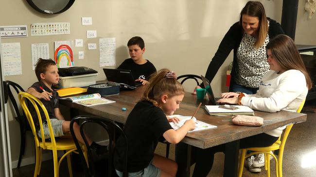 Vanessa Herbert is acting as the stand-in lockdown teacher for her children Jake, Blake, Zoe and Gemma Picture: Hamish Blair