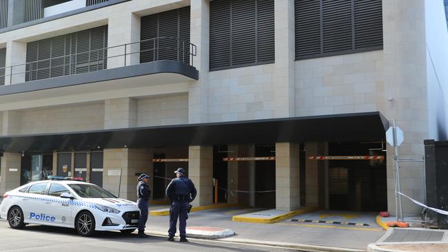 Police outside the carpark entry to Nazlioglu’s apartment block at 8 Walker St last June.