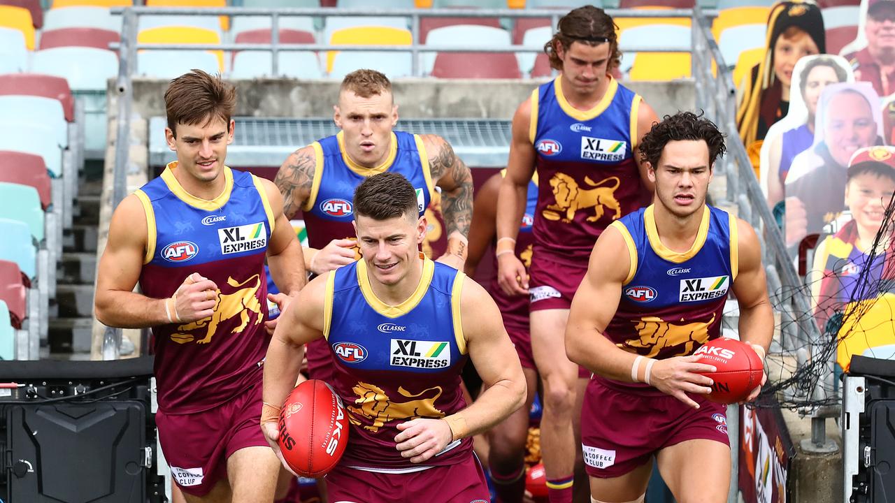 Dayne Zorko (front) is ready to again lead out the Lions. Picture: Jono Searle/AFL Photos/via Getty Images