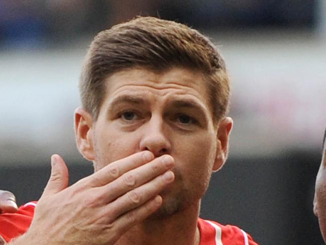 Liverpool's English midfielder Steven Gerrard (L) celebrates scoring a penalty for their second goal with Liverpool's English striker Daniel Sturridge (R) during the English Premier League football match between Tottenham Hotspur and Liverpool at White Hart Lane in London on August 31, 2014. AFP PHOTO / OLLY GREENWOOD RESTRICTED TO EDITORIAL USE. No use with unauthorized audio, video, data, fixture lists, club/league logos or “live” services. Online in-match use limited to 45 images, no video emulation. No use in betting, games or single club/league/player publications