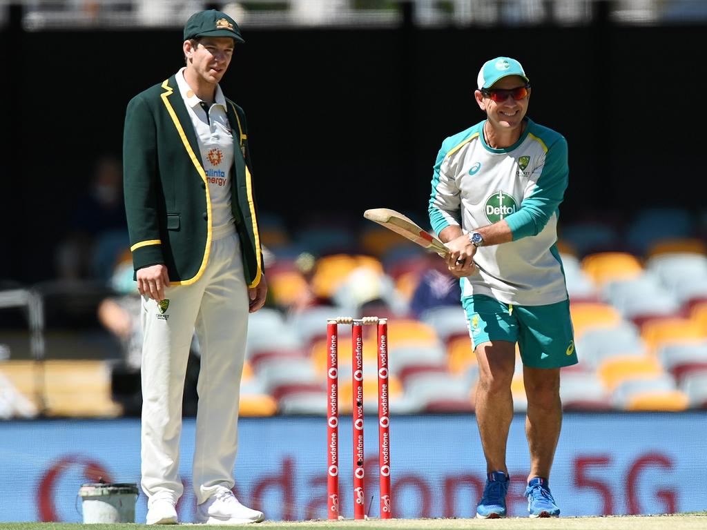 Tim Paine and Justin Langer inspect the pitch at the Gabba in January 2021. No one could have predicted the fate of both men a year on. Picture: Bradley Kanaris/Getty Images