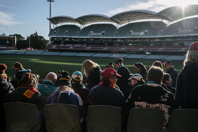 Crows and Port Adelaide fans sitting together on the southern side of Adelaide Oval as extras in the film 